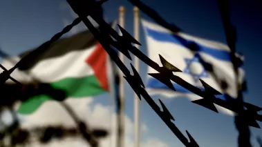 Flags of Israel and Palestine and barbed wire