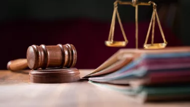 gavel and scales of justice on a table