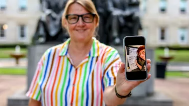 Photo of FIRE plaintiff Susan Hogarth holding up her phone showing her ballot selfie