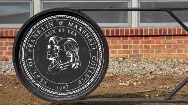 emblem for Franklin and Marshall College located on a gate