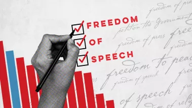 Bar graphs on a sheet of paper with a hand writing "Freedom of Speech"
