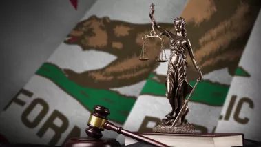 California US state flag with statue of lady justice, constitution and judge hammer on black drapery