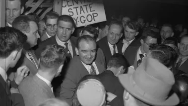 Senator Joseph R. McCarthy greets admirers at a Republican Party dinner that honored him in Milwaukee on December 11, 1951