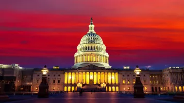 The United States Capitol building at sunset at night in Washington DC