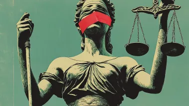 Statue of justice holding scales with red tape over her mouth