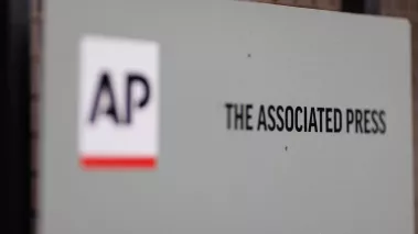 Close-up of a sign with The Associated Press logo