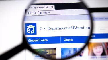 Department of Education website under a magnifying glass