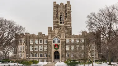 Fordham University Graduate School of Arts and Sciences in New York City in the winter with a wreath over the entrance