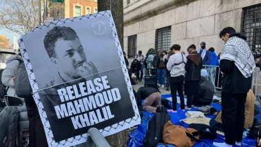 "Release Mahmoud Khalil" sign next to pro-Palestinian protestors outside Columbia University