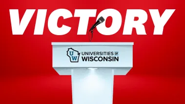 UW podium with VICTORY in large font above