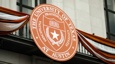 The University of Texas at Austin academic seal on the outside of a campus building