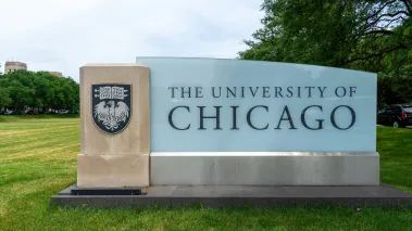 A University of Chicago sign on the Midway Plaisance in summer