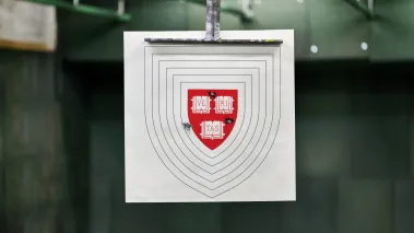 Harvard seal as a printed shooting target with bullet holes