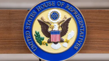 Official seal of the US House of Representatives on a podium