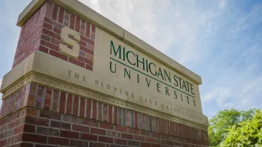 Michigan State University sign at the Bogue Street entrance on a August Summer day