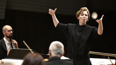 Rebecca Bryant Novak conducting an orchestra