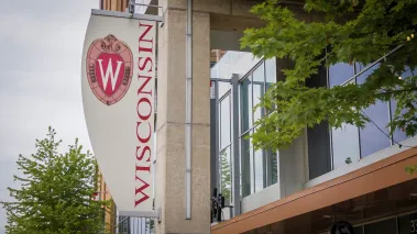University of Wisconsin banner with logo on a campus building in 2022