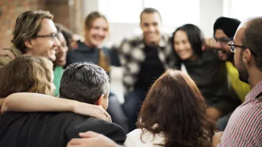 Students stand together in a circle