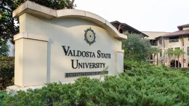 Valdosta State University ground sign surrounded by bushes
