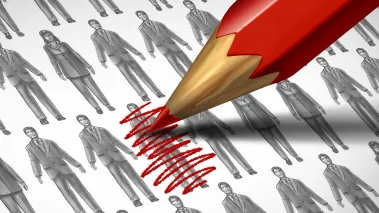 Red pencil crossing out a black and white image of a person, indicating cancel culture and censorship