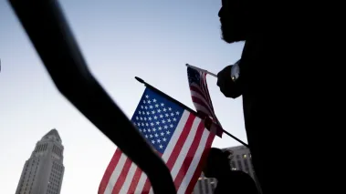 People attend a vigil for Charlie Kirk in Los Angeles on Sept. 11, 2025