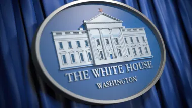 White House seal on blue curtain background