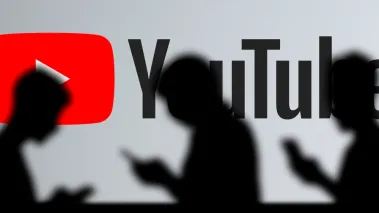 YouTube sign with people walking by