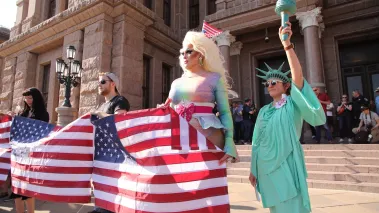 Drag performer and a woman dressed as the Statue of Liberty protest Donald Trump's policies at a No Kings rally at the Texas state capitol in Austin.