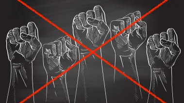 Protest fists drawn on black chalkboard with a red strike crossing them out.