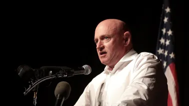 Senator Mark Kelly delivering a speech