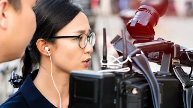 Student journalist filming on campus