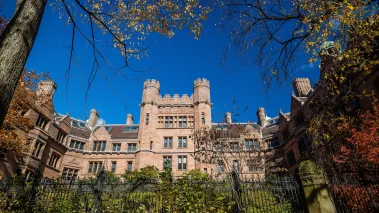 Yale university buildings with iron gate in autumn with blue sky in New Haven, Connecticut.