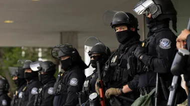 Los Angeles, California, USA - June 10, 2025: U.S. Customs and Border Protection (CBP) field officers guard a federal building during ICE deportation protests in Downtown LA. 