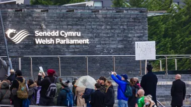 Protesters gather on the steps of the Welsh Parliament in November 2021.