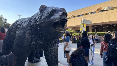 UCLA students near the Bruin Bear on campus in Los Angeles (Image via Shutterstock.com)
