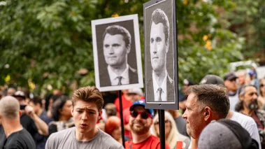 Charlie Kirk posters at an anti-immigration rally in Canada in September 2025.