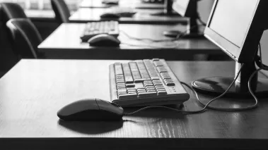 Corporate classroom with keyboards and screens
