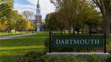 Dartmouth College entrance sign on the green.