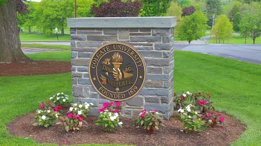 Sign marking the campus of Colgate University in the village of Hamilton in rural upstate New York (Image via Shutterstock.com)