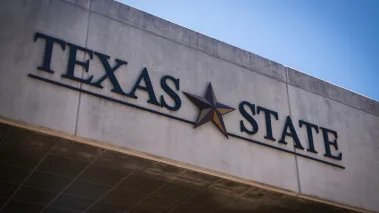 Texas State University logo on a building