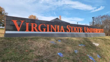 Virginia State University sign on a hill overlooking painted Greek life rocks located in the village of Ettrick in Chesterfield County. (Image via Shutterstock.com)