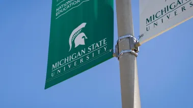 Michigan State University banner on campus in East Lansing (Image via Shutterstock.com)