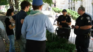 Protestors seen in heated conversation with the Pittsburgh Police at the encampment held at the University of Pittsburgh between Police on the Cathedral of Learning lawn.