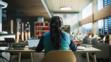 student in library