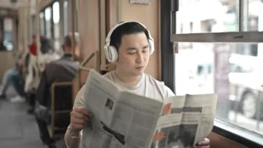 student reads newspaper