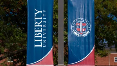 Campus flag and motto at Liberty University in Lynchburg Virginia. (Image via Shutterstock.com)