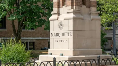 Entrance gates and logo to Marquette University in Milwaukee. (Image via Shutterstock.com)