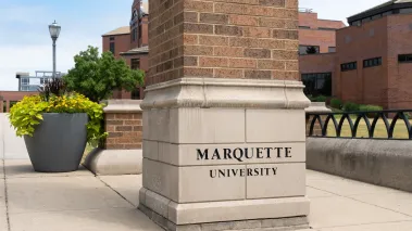 Entrance sign and logo to Marquette University in Milwaukee. (Image via Shutterstock.com)