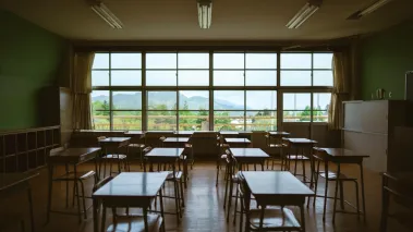 empty classroom with a large window in the background