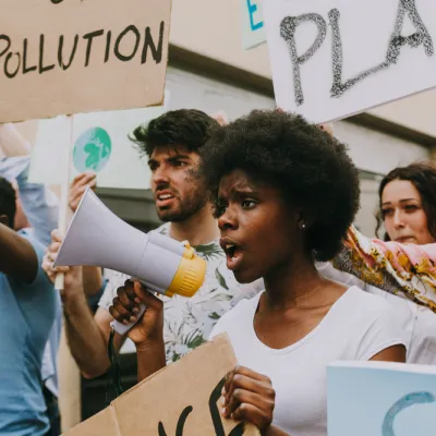 student protesters holding bullhorns and signs